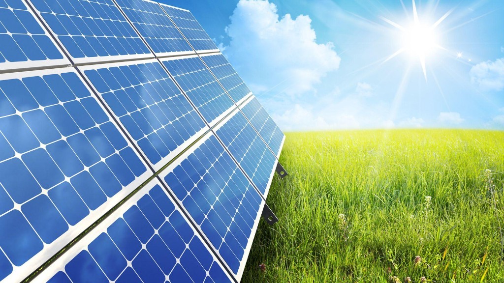 Ground-mounted solar panels in green field